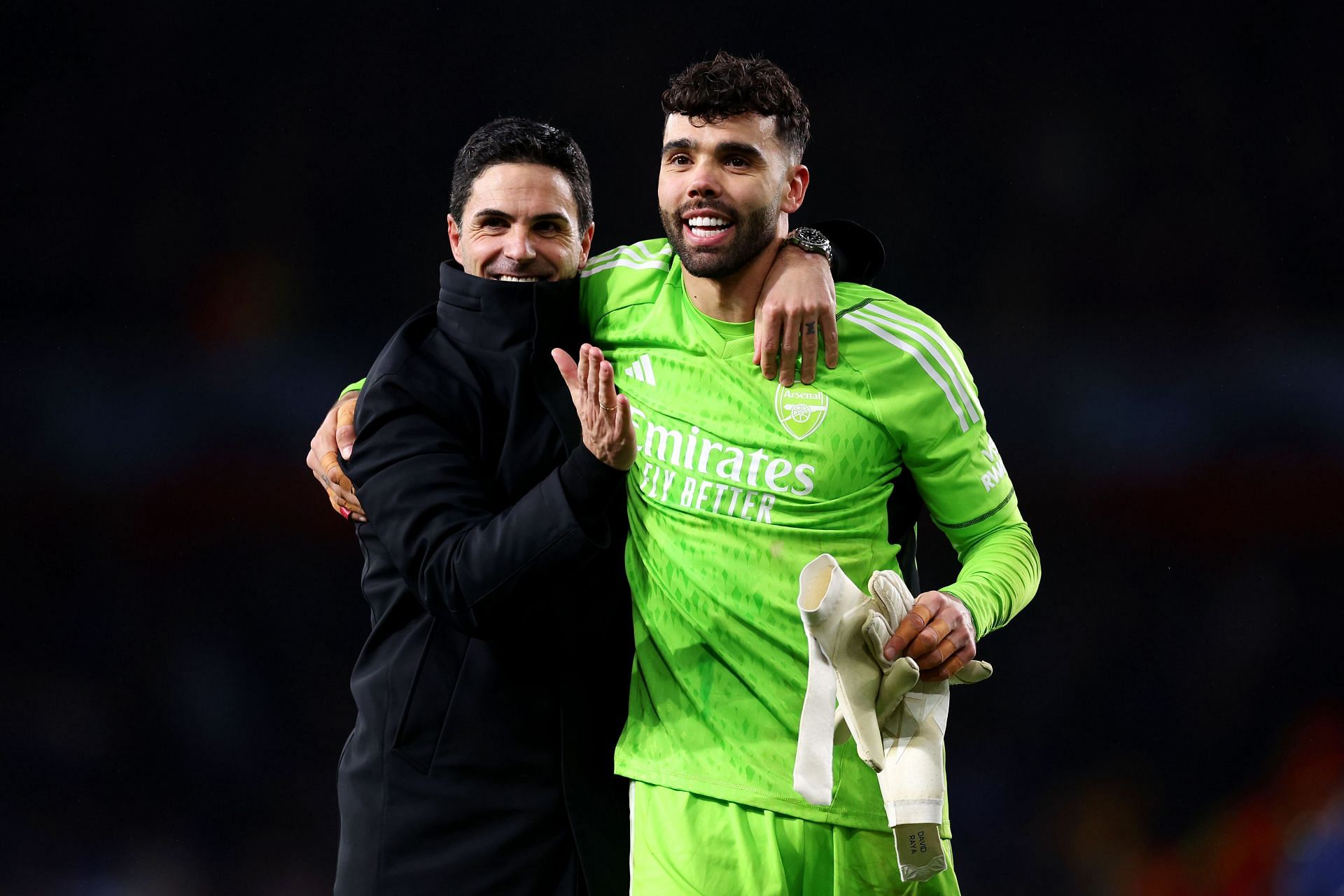 Mikel Arteta (left) and David Raya